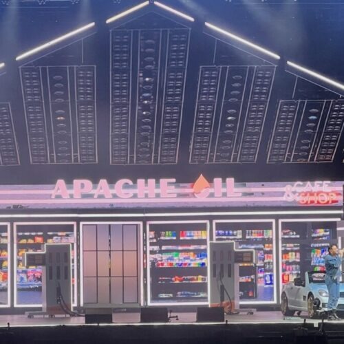 Stage of the Apache 207 Concert looking like a Gas station