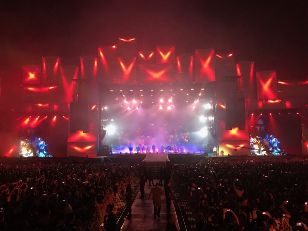 Huge crowd in front of a bright lit stage at a Pet Shop Boys concert produced by 1314