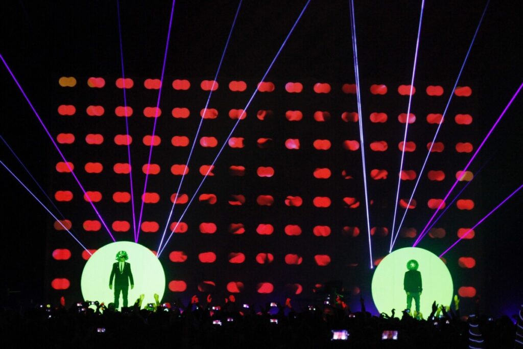Huge crowd in front of a bright lit stage at a Pet Shop Boys concert produced by 1314