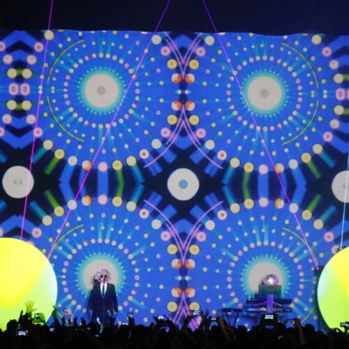 Huge crowd in front of a bright lit stage at a Pet Shop Boys concert produced by 1314