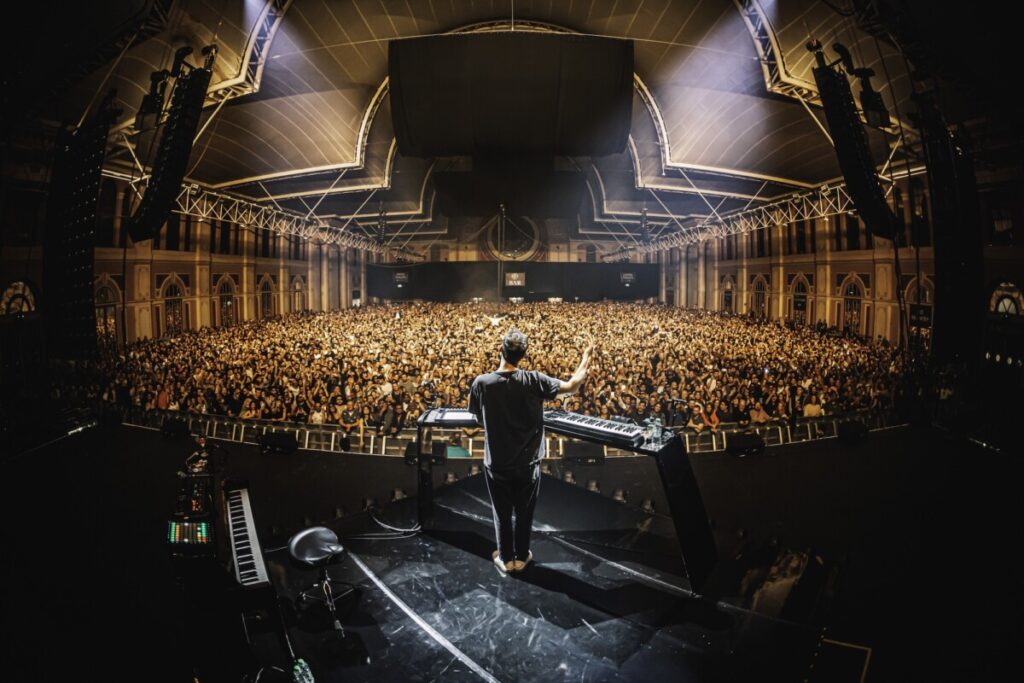 Ben Böhmer on the stage of his concert produced by 1314 in front of a huge crowd of people