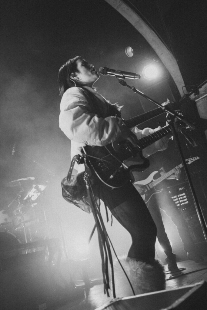 Singer and guitarist on stage