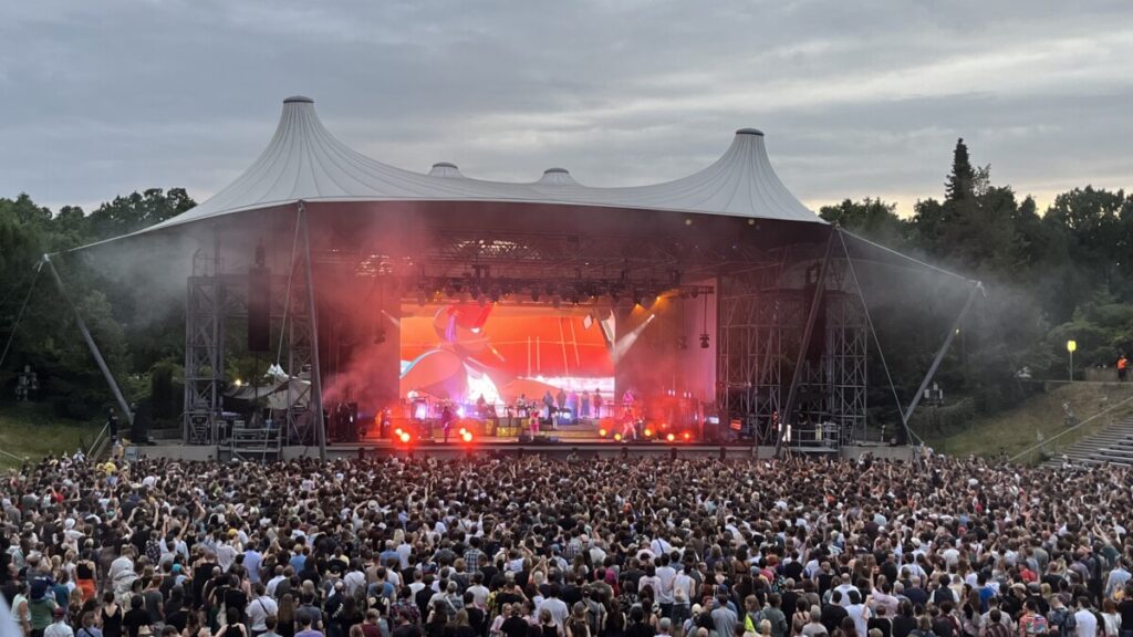 Crowd in front of a stage at a concert produced by 1314