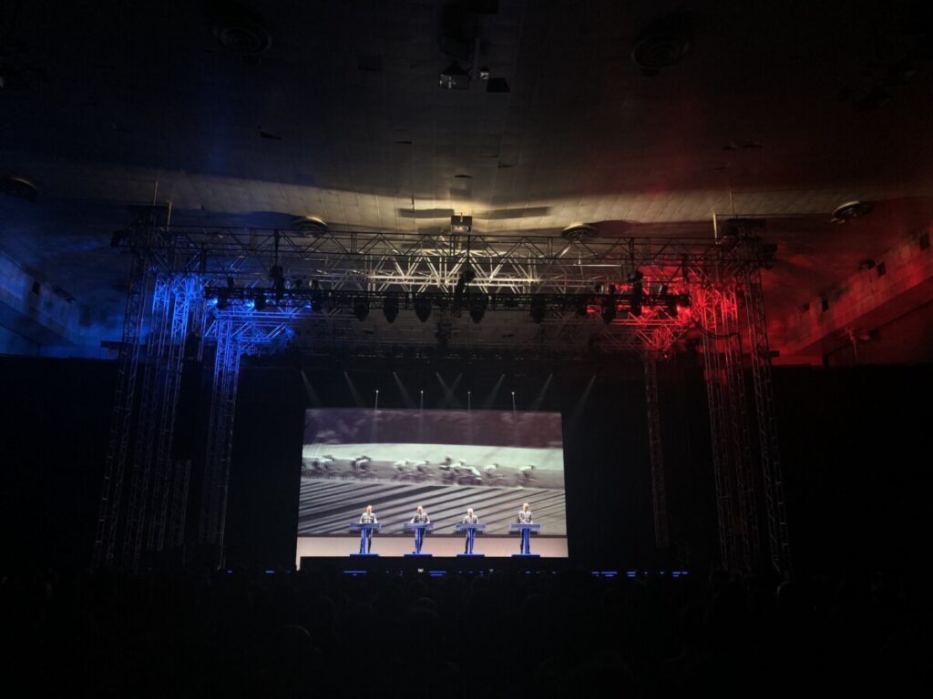 Stage with four people on it of a Kraftwerk concert produced by 1314