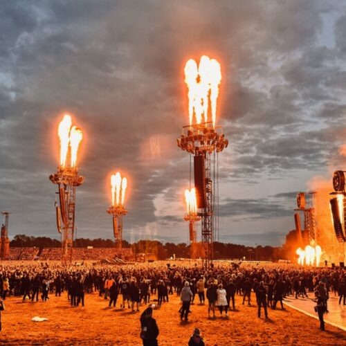 Crowd in front of a stage at a concert produced by 1314